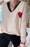Pull beige coeur rouge