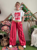 Pantalon à rayures rouge/fushia avec ceinture